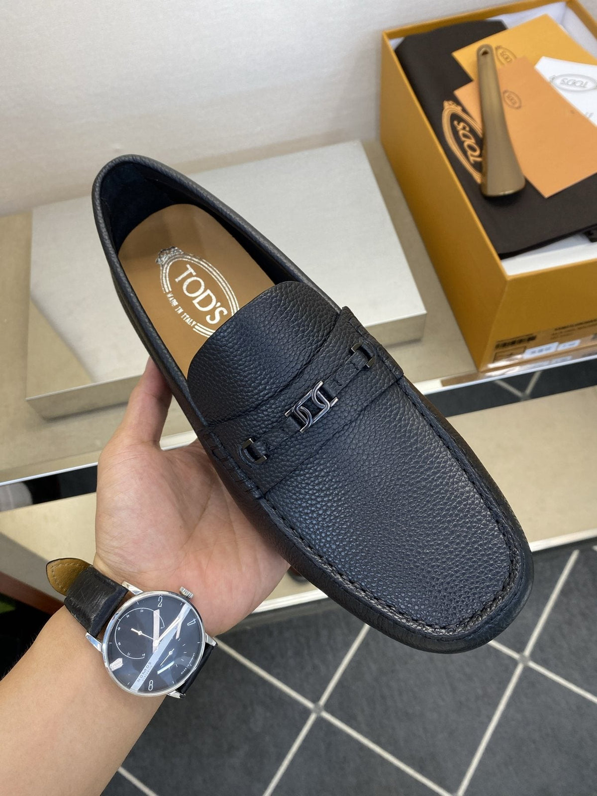 Tod's Black Leather Penny Loafers — model