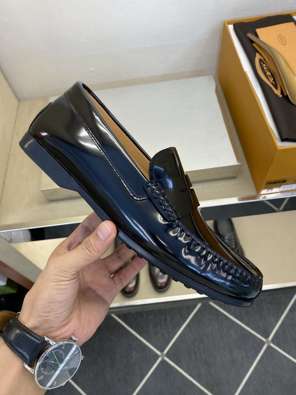 Tod's Glossy Dark Navy Penny Loafers — side