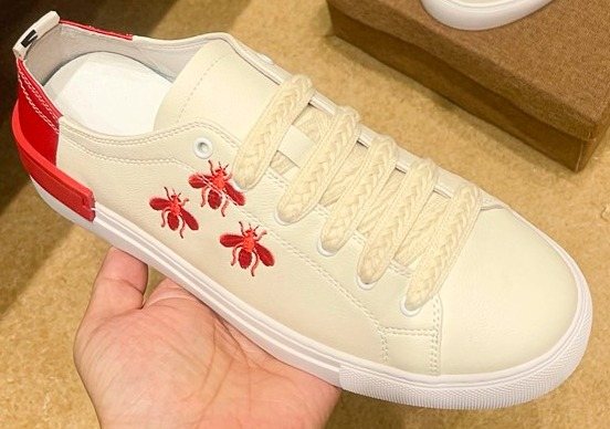 White Low-Top Sneakers with Red Floral Accents — front