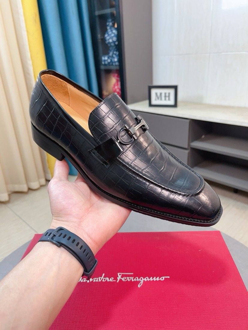 Ferragamo Black Embossed Bit Loafers — model