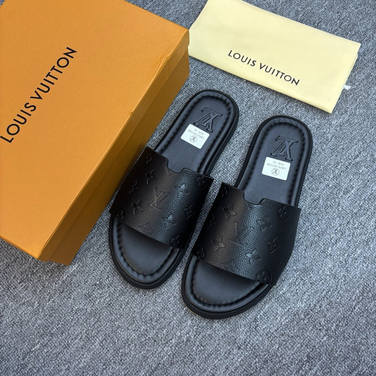Louis Vuitton Black Embossed Strap Slide Sandals — front
