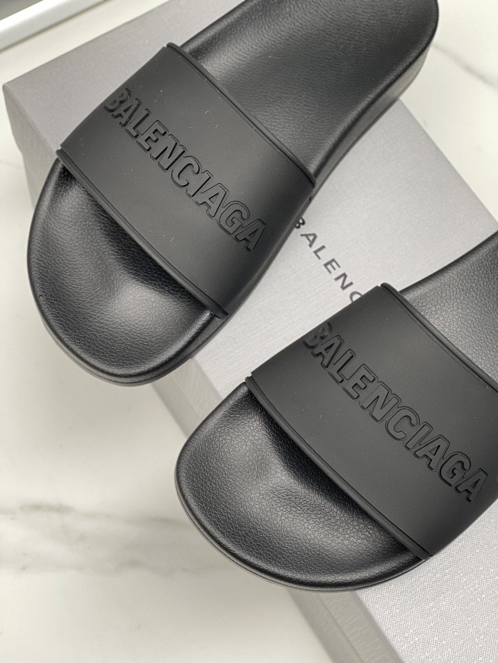 Balenciaga Black Embossed Slide Sandals — detail