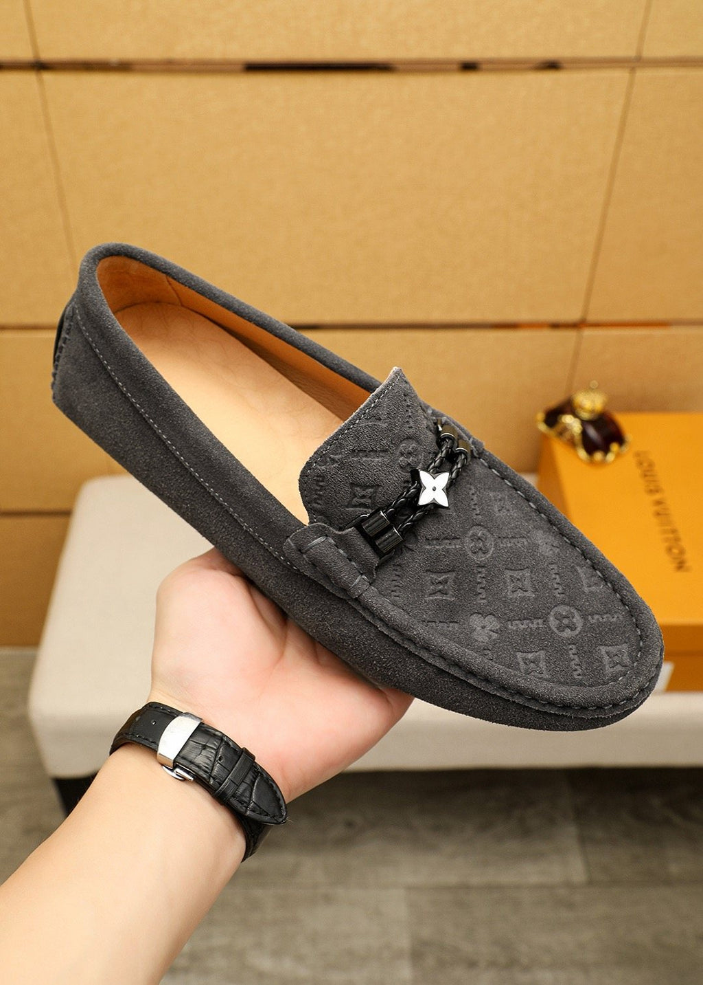 Louis Vuitton Embossed Metal-Detail Loafers — model