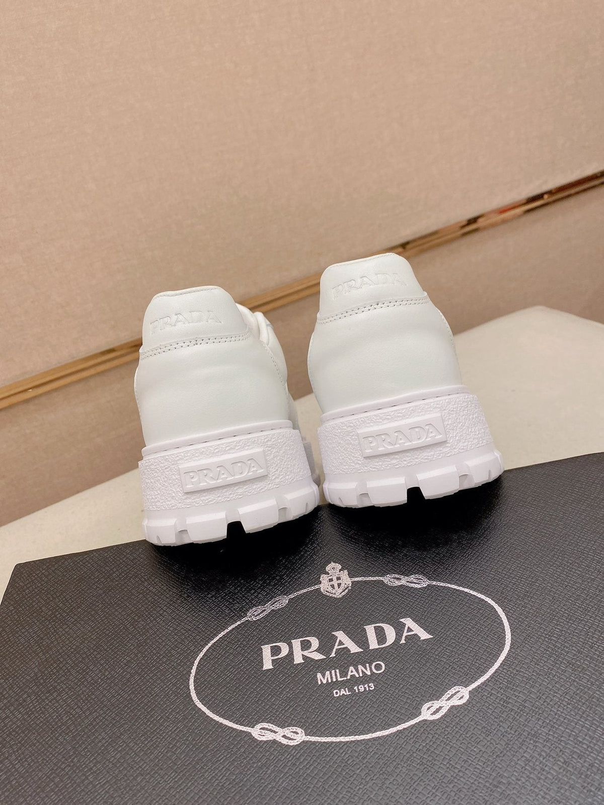 Prada Triangle Plaque Low-Top Sneakers — back