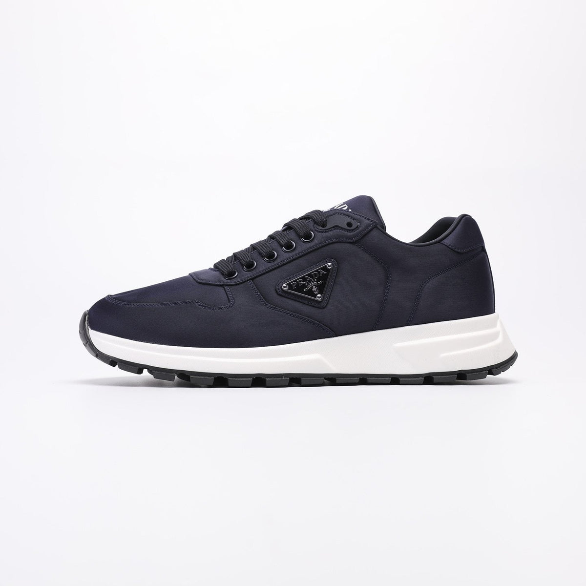 PRADA Navy Triangle Badge Sneakers — front