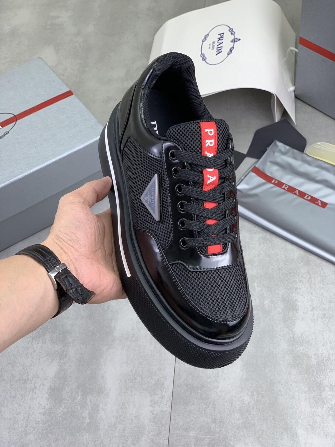 Prada Triangle Patch Low-Top Sneakers — model