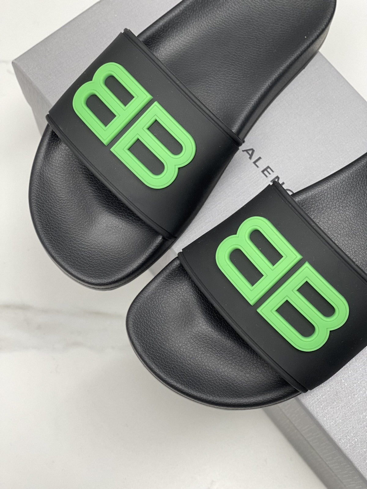 Balenciaga Raised Motif Slide Sandals — hero