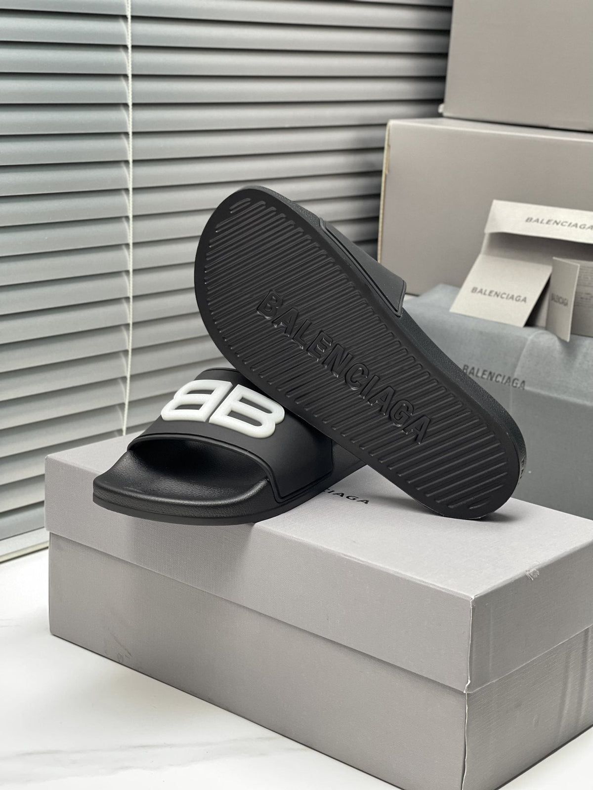 Balenciaga Raised Motif Slide Sandals — side