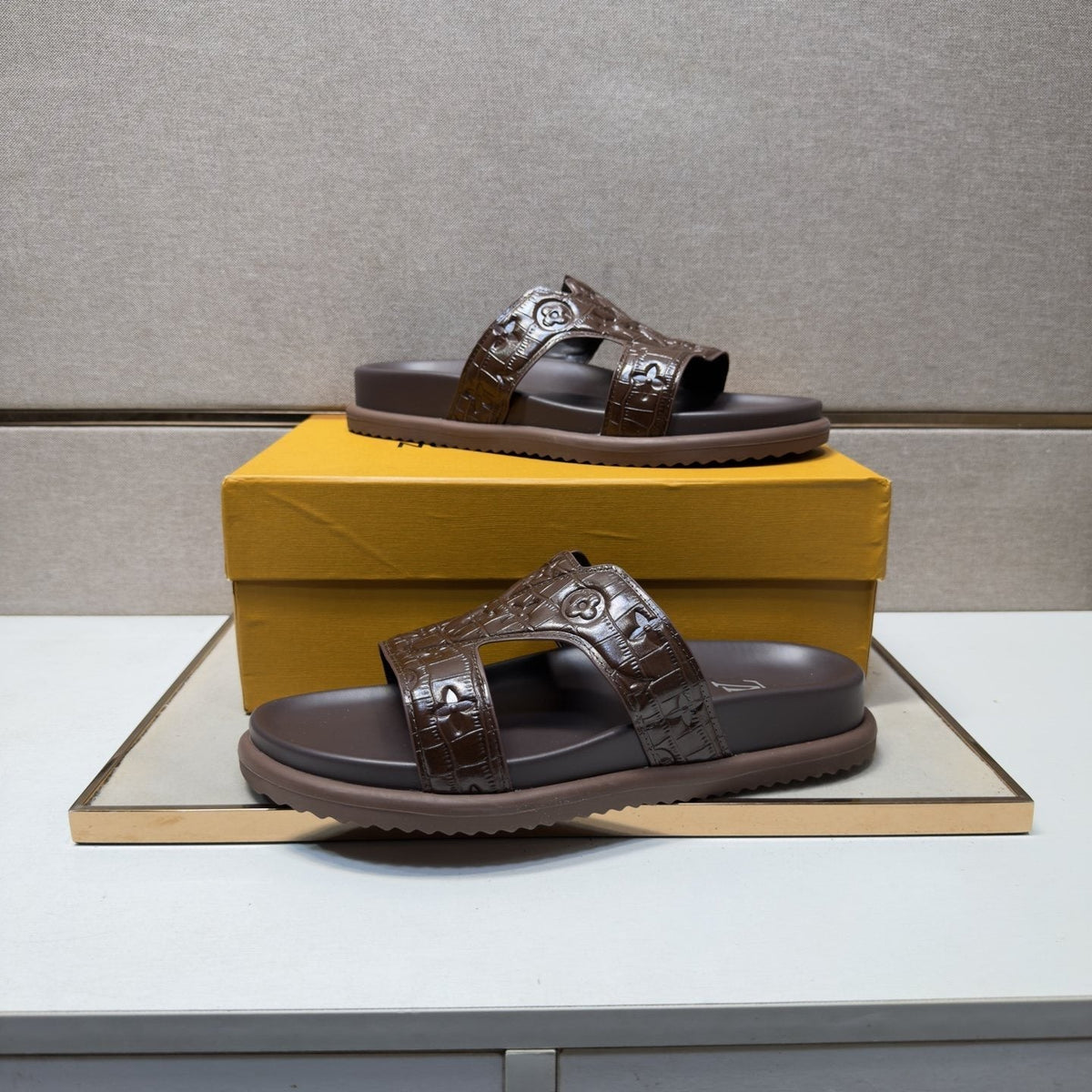 Louis Vuitton Textured Monogram Slide Sandals — model